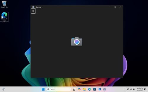 The camera application displays a black screen 