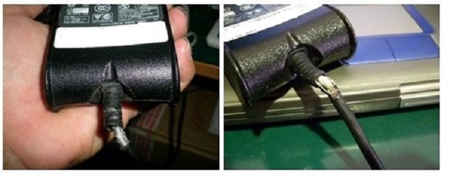 Beispiel für ein ausgefranstes Kabel an einem Netzadapter.
