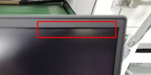 One bright hot spot seen on the top right of the screen in normal room lighting