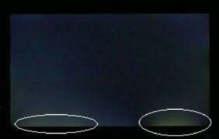 Multiple light leakage seen on the bottom edge of the screen when inspected in a dark room