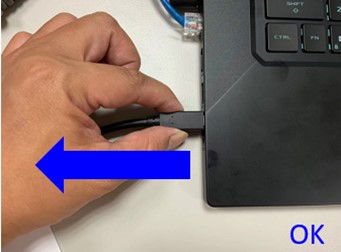 Correct technique showing a hand holding both sides of USB-C connector to remove it straight from laptop port