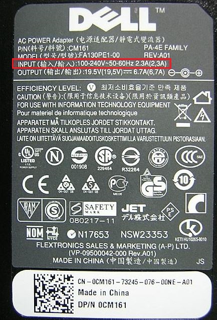 Image de l’étiquette sur un adaptateur secteur Dell affichant les informations de tension