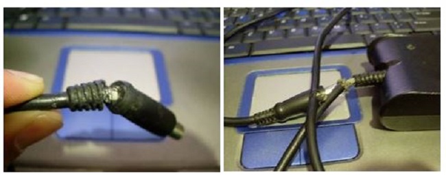 Exempel på en frilagd ledningstråd på nätadapterkontakten