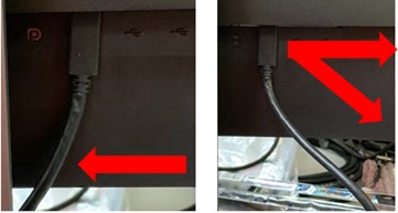Técnica incorrecta que muestra que el cable USB-C se dobla bruscamente mientras se inserta en el puerto del monitor
